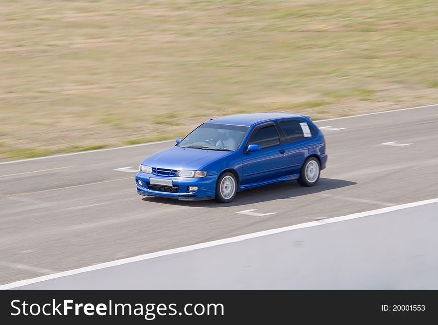 Fast blue car in a race. Fast blue car in a race