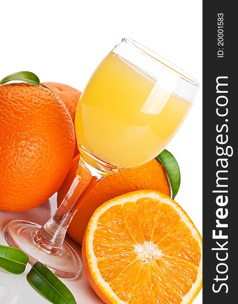 Orange juice in glass and fruits isolated on a white background