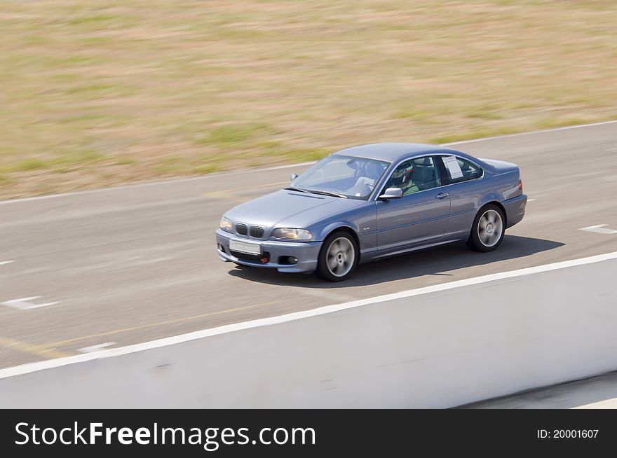 Fast grey car in a race. Fast grey car in a race