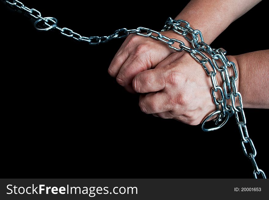 Hands in chain on a black background