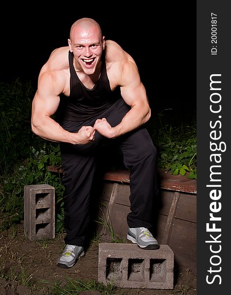Pumped white guy posing in the backyard. Pumped white guy posing in the backyard