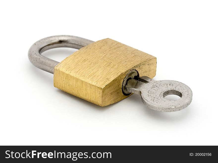Padlock And Key Over White
