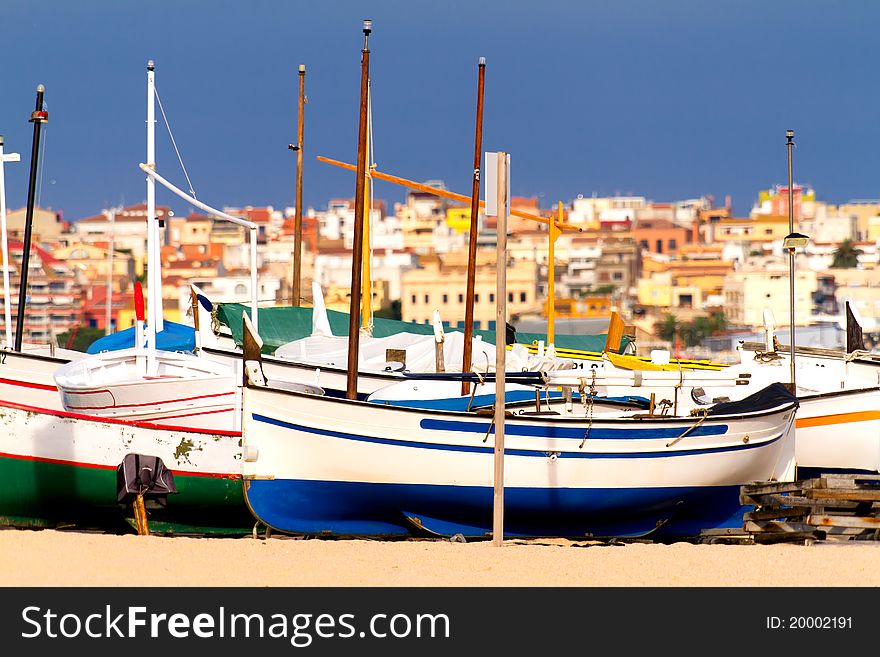 Colorful boats rest on the Spanish coast