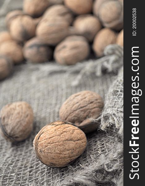 Walnuts on a background of rough cloth. Walnuts on a background of rough cloth