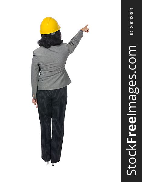 Women engineer wear yellow helmet pointing something. Women engineer wear yellow helmet pointing something
