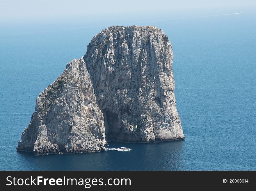 The famous Faraglioni, rocks in Capri island. The famous Faraglioni, rocks in Capri island.