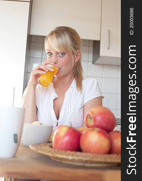 Young Blond Woman With Her Breakfast