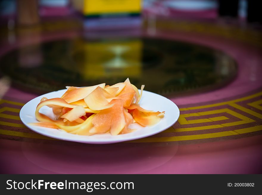 Sliced papaya fruit served on plate as appetizer