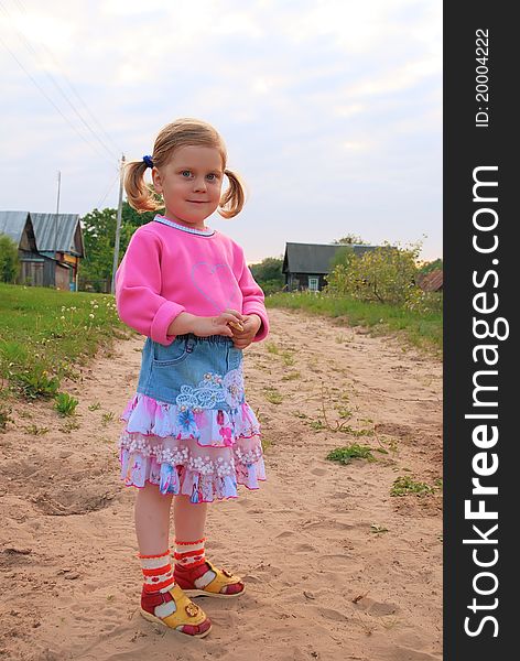 Pretty smiling girl on rural road. Pretty smiling girl on rural road