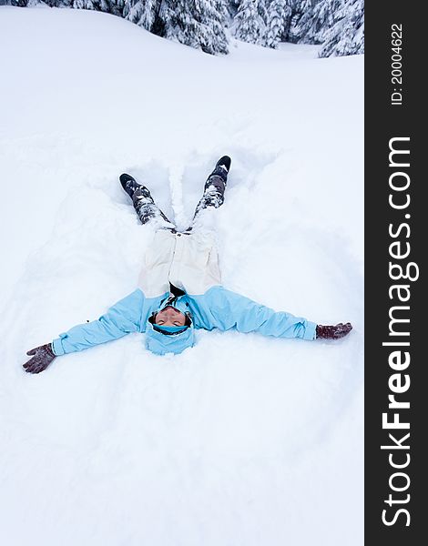 Hiker girl lying in snow. Hiker girl lying in snow
