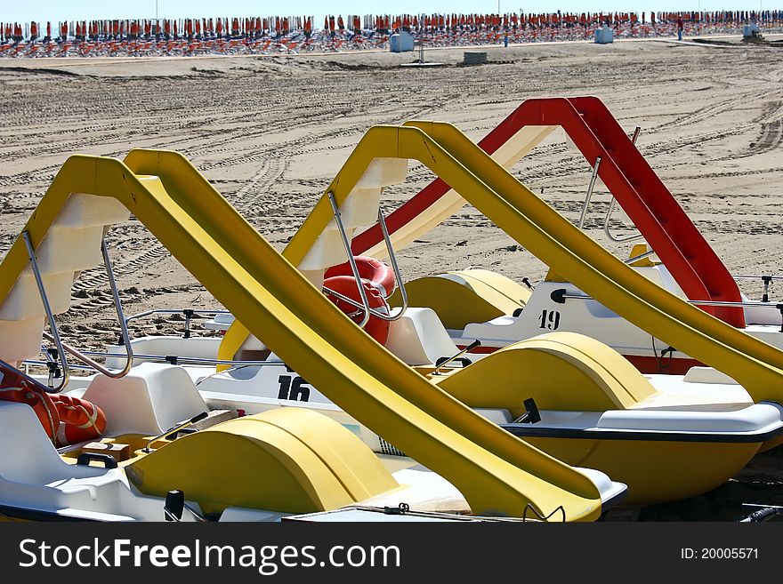 Paddle-boats with slides on it at the beach