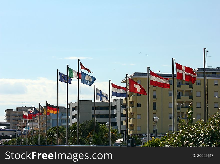Several european flags at the coast