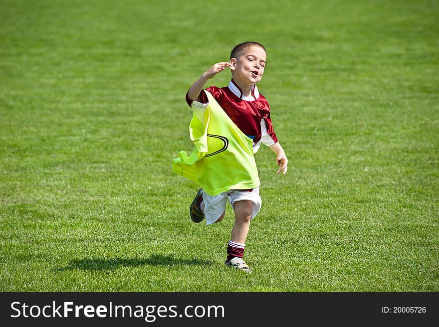 Happy boy on the soccer field