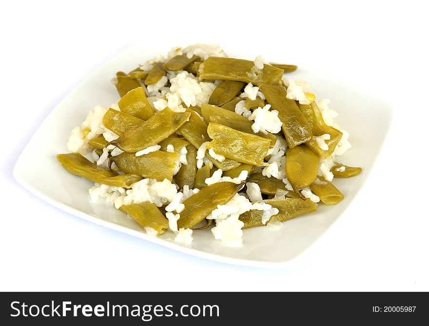 A dish of green beans and rice with addition of olive oil and salt, suitable for vegetarians and vegans alike. A dish of green beans and rice with addition of olive oil and salt, suitable for vegetarians and vegans alike
