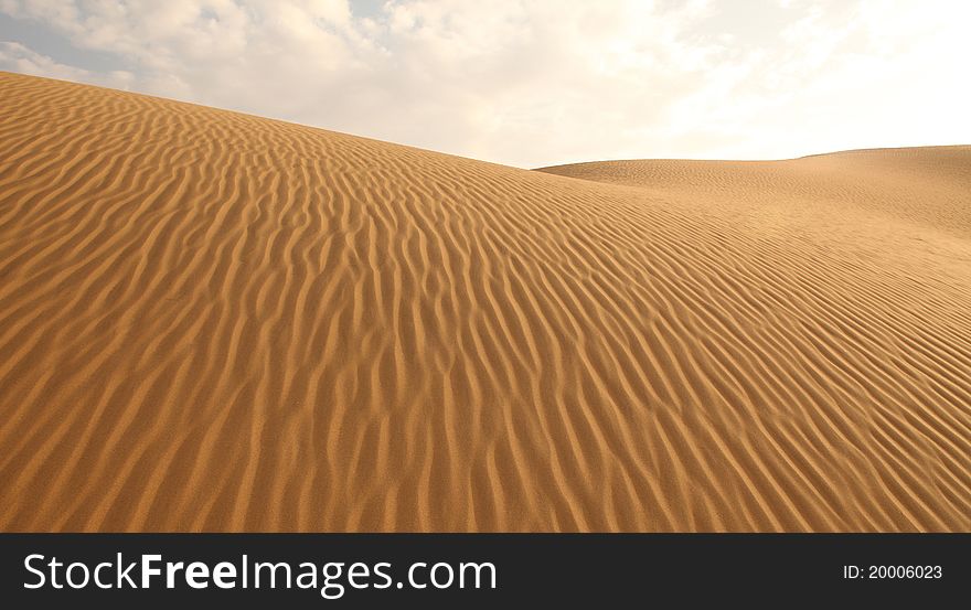 Sand Dunes And Cloudless Sky