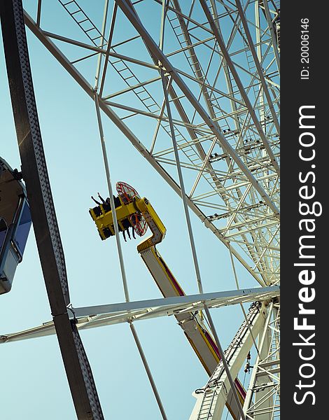 Detail of Ferris wheel structure over blue sky. Detail of Ferris wheel structure over blue sky.