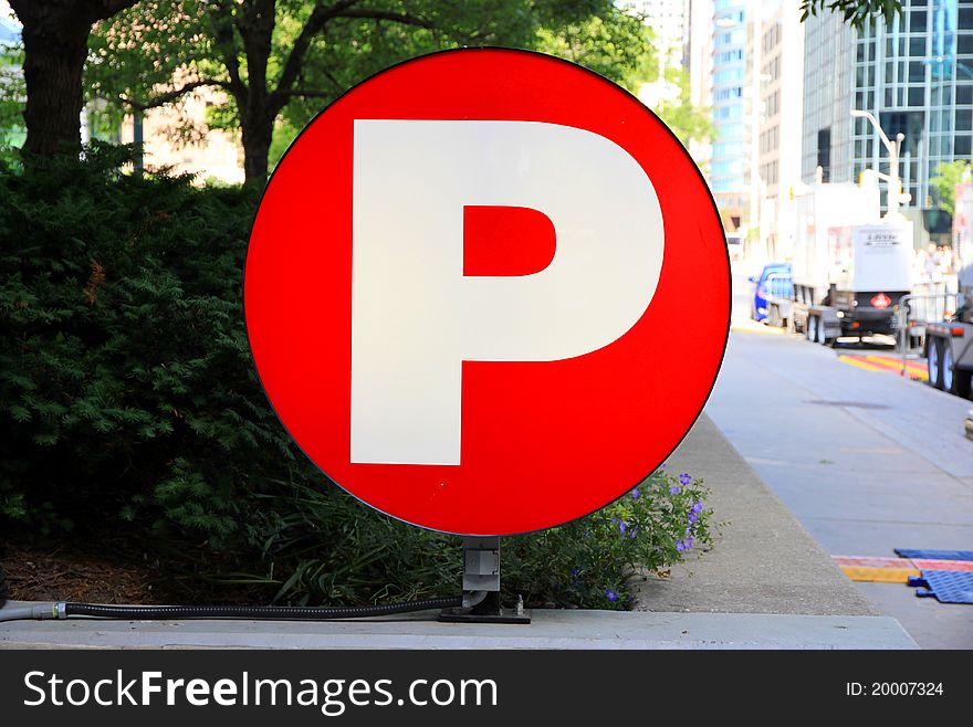 A white P of Parking on red background