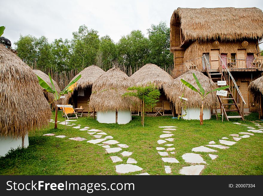 Beach bungalow on the green grass