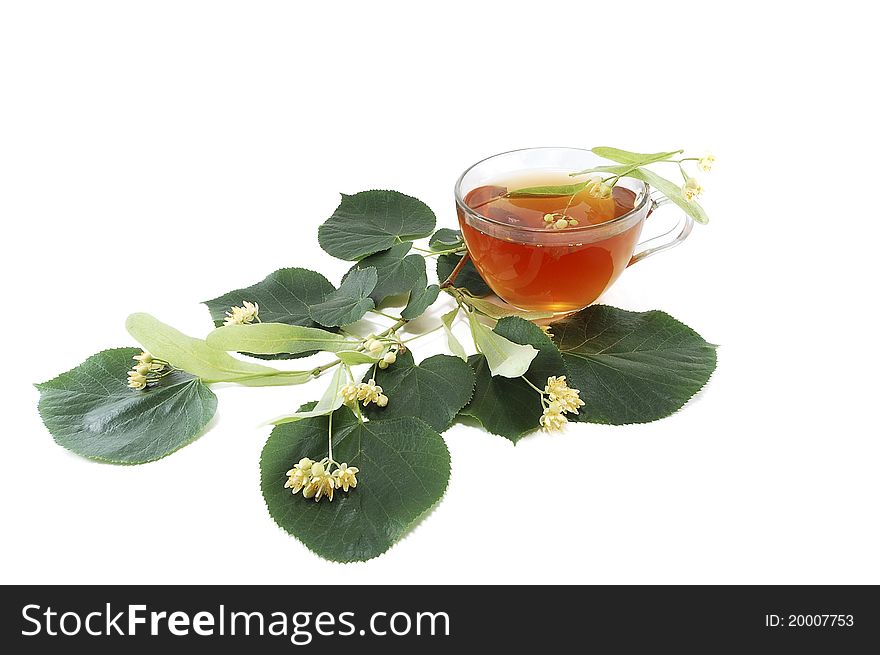 Curative tea from the flowers of linden isolated on white background