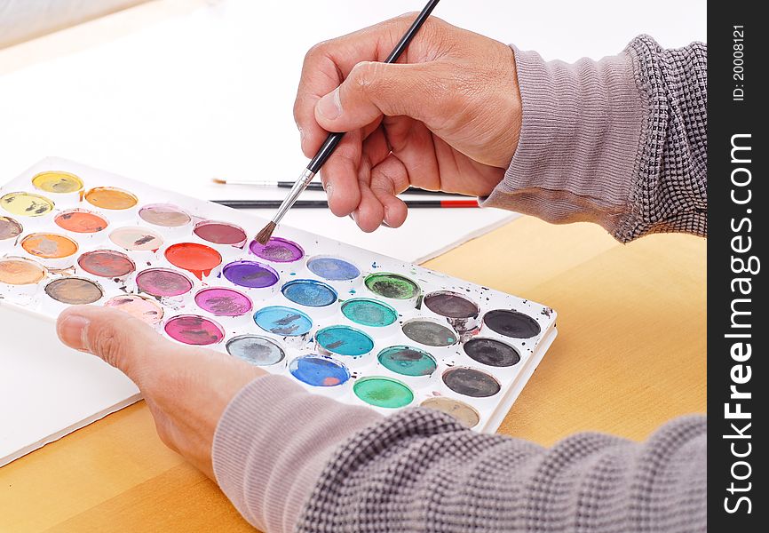 Man Choosing His Colors For Painting. Man Choosing His Colors For Painting