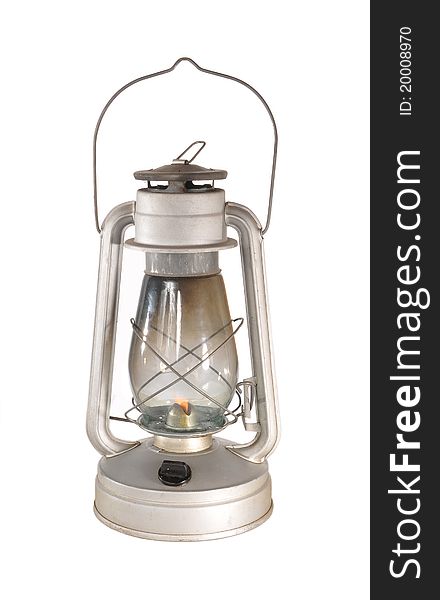 In a metal lamp with kerosene burns fire. In a metal lamp with kerosene burns fire