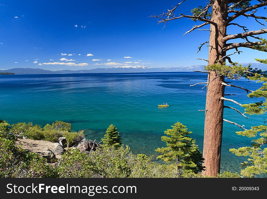 Beautiful Lake Tahoe shore with few clouds on sky