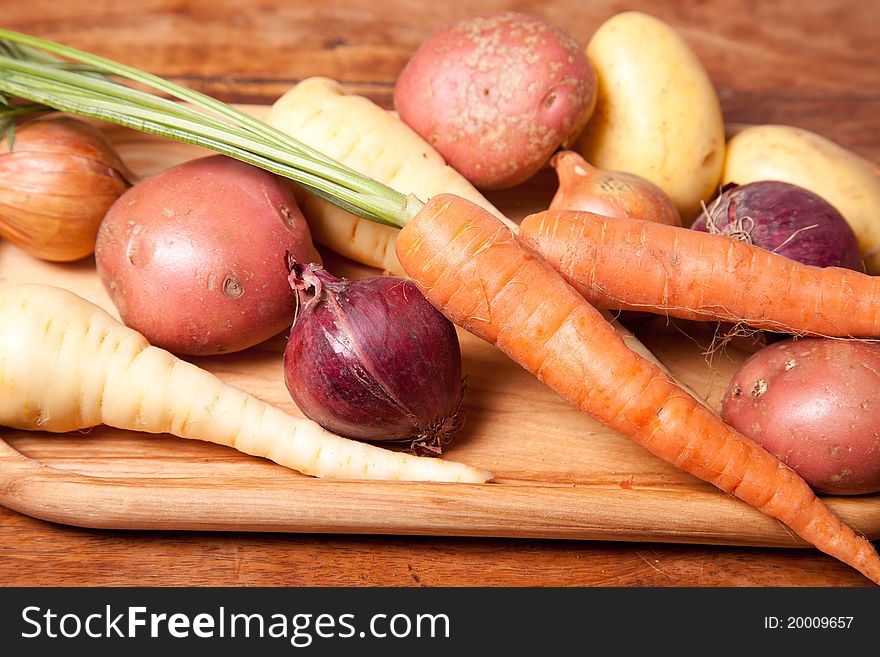 Selection of fresh vegetables on the wooden table, close up picture. Selection of fresh vegetables on the wooden table, close up picture.