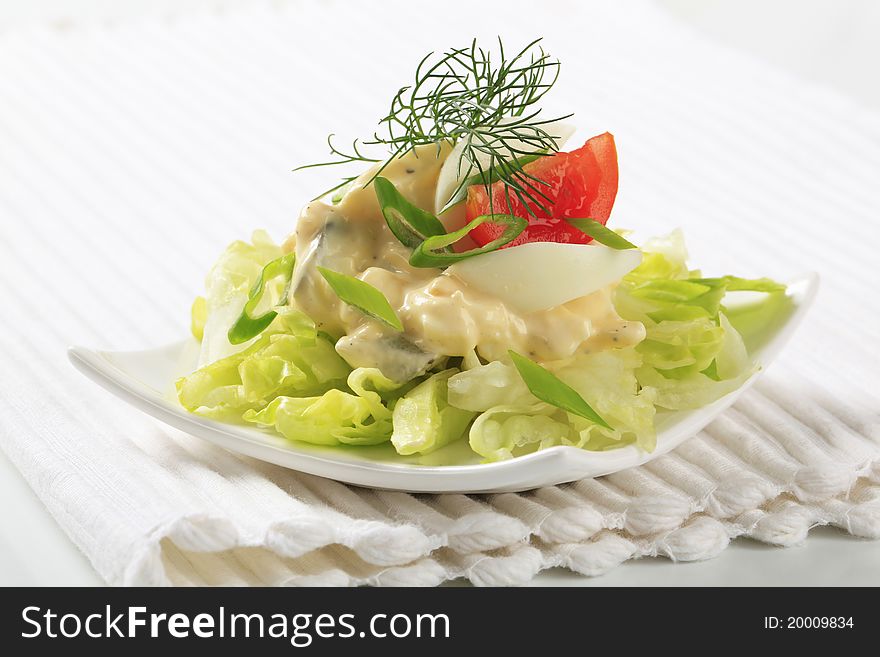 Egg salad on a nest of fresh lettuce