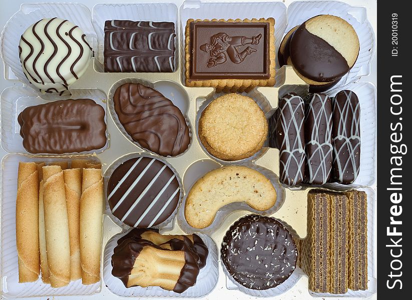 Chocolate covered biscuits in plastic box