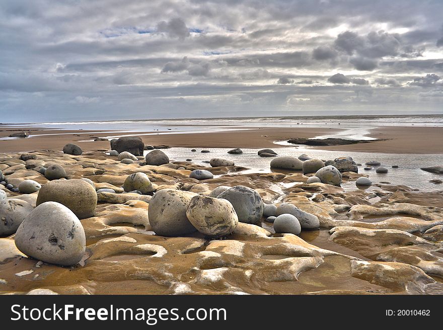 A rocky beach on an overcast day.