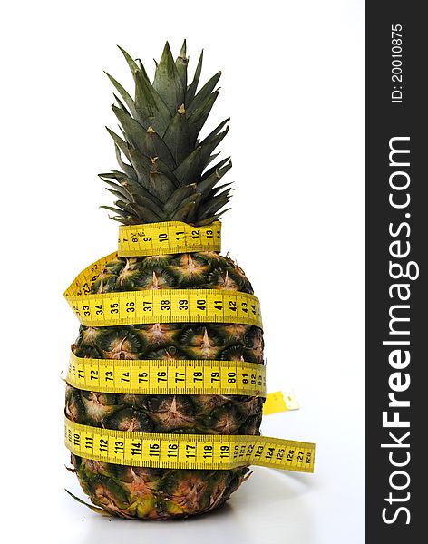 Ananas with tape rule. concept of diet