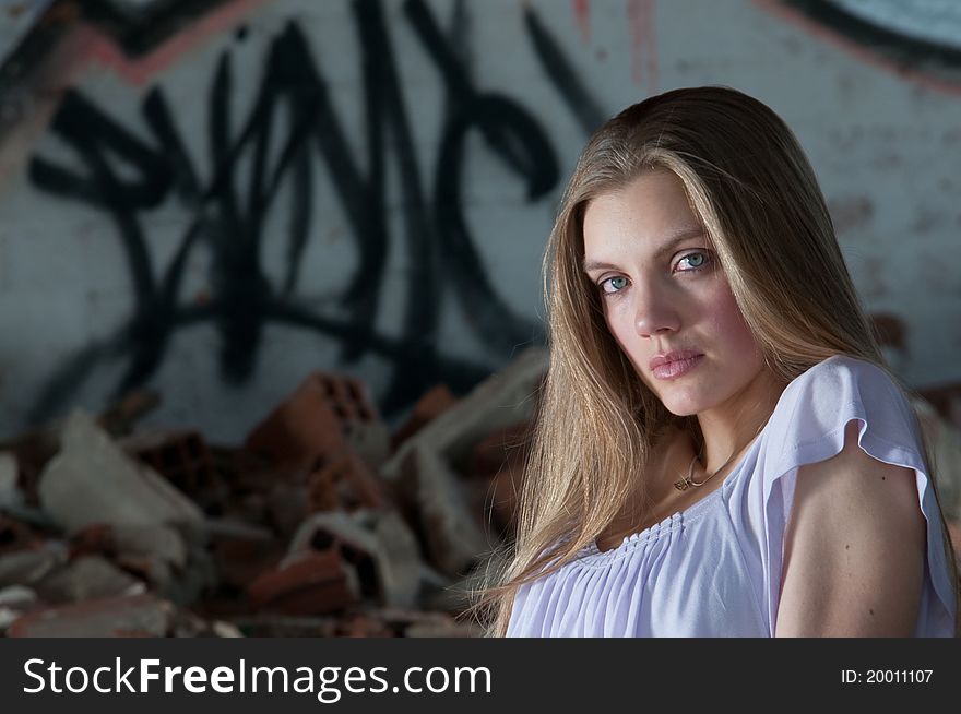 One beautiful woman is sit in a place surrounded by bricks. 
The location looks like an abandoned place and so that it is on ruins. The girl is looking straight to the camera. She dresses one short, boot and one clear t-shirt. One beautiful woman is sit in a place surrounded by bricks. 
The location looks like an abandoned place and so that it is on ruins. The girl is looking straight to the camera. She dresses one short, boot and one clear t-shirt.