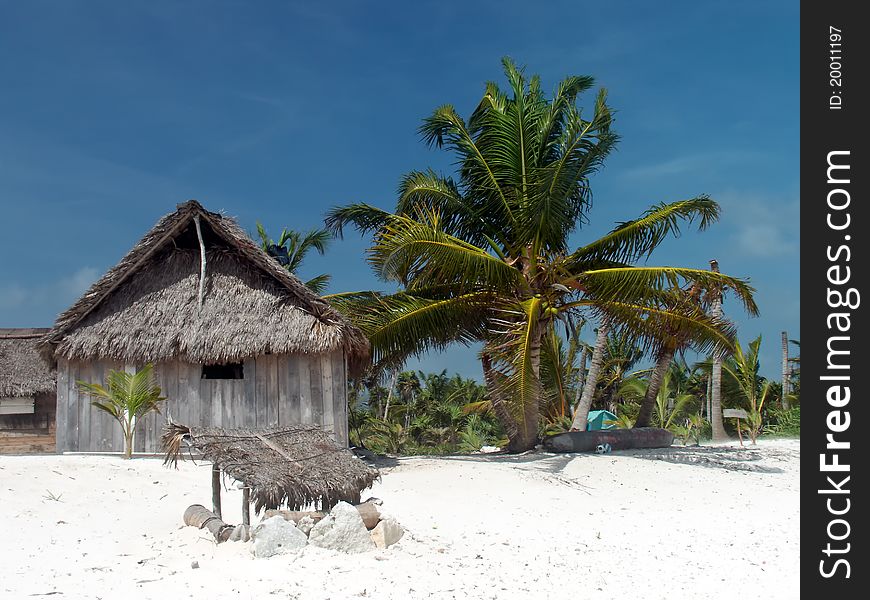 Coconut palm leaves hut on the caribbean beach. Coconut palm leaves hut on the caribbean beach.