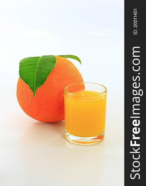 Orange juice in glass on white background. Orange juice in glass on white background