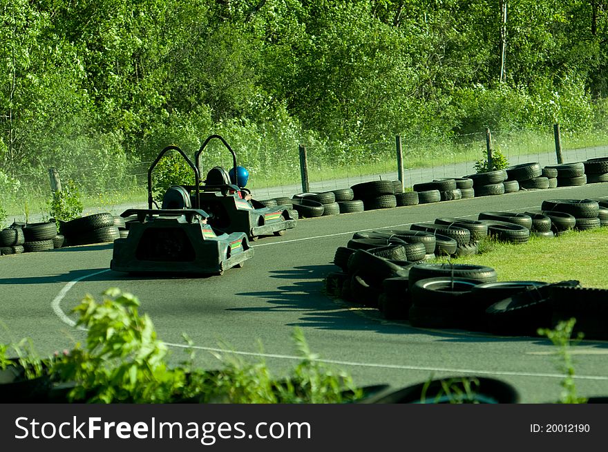 Two carts on a go-cart track. Two carts on a go-cart track