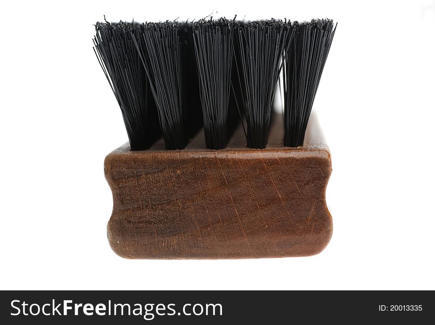 Wooden brush for cleaning clothes isolated on white background.