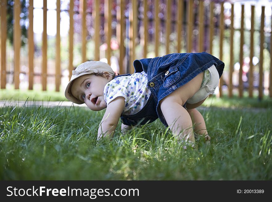 Baby girl outdoors in the grass