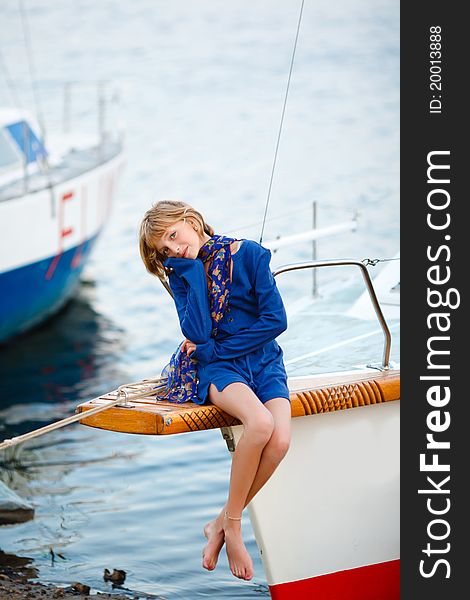 Playful pretty little girl on sail boat