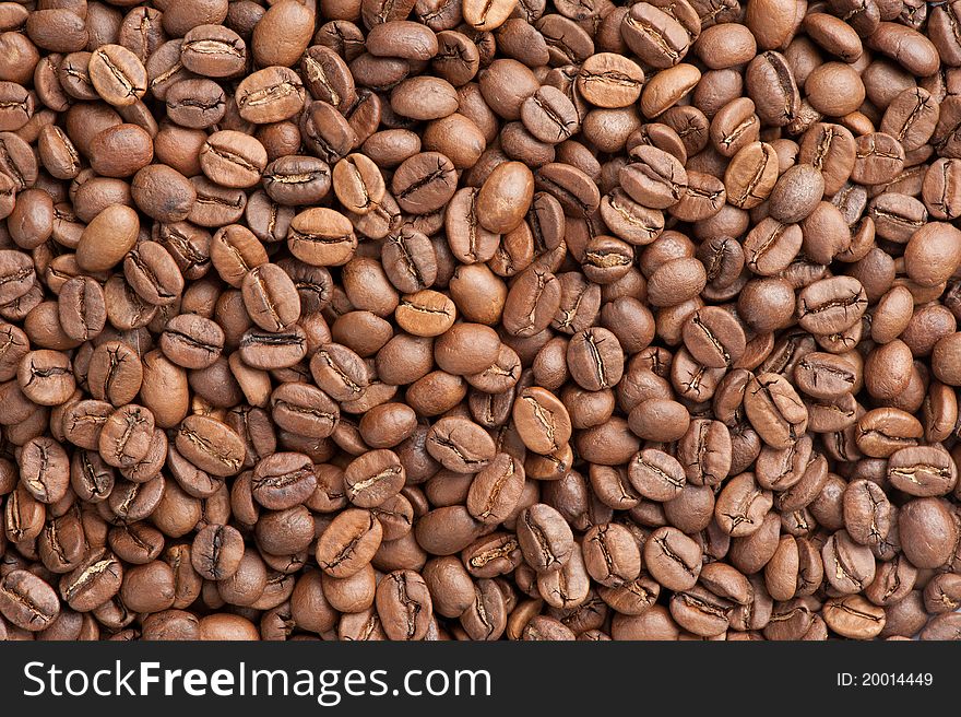 Roasted coffee beans background closeup