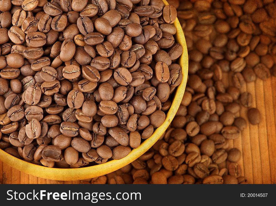 Macro studio shot of a cup of coffee beans