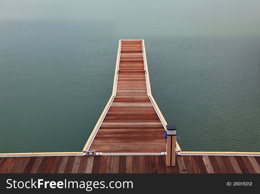 New wooden jetty walkway and pathway pier of marina on sea. New wooden jetty walkway and pathway pier of marina on sea