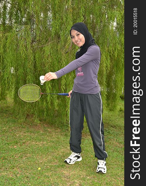 Young woman with badminton racket