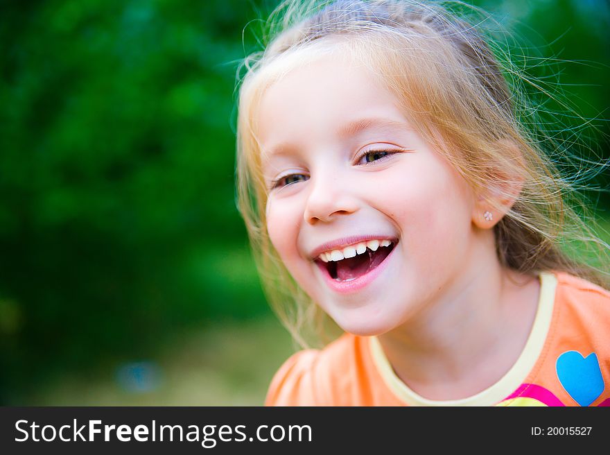 Cute little girl  on the meadow