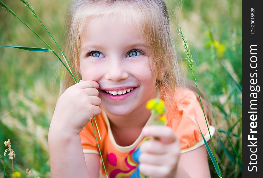 Cute Little Girl  On The Meadow