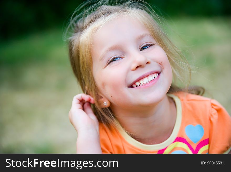 Cute little girl  on the meadow