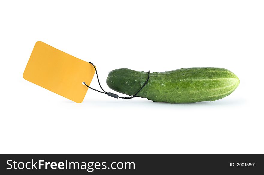 Freshness green cucumber with blank yellow paper label on white background. Isolated with clipping path. Freshness green cucumber with blank yellow paper label on white background. Isolated with clipping path