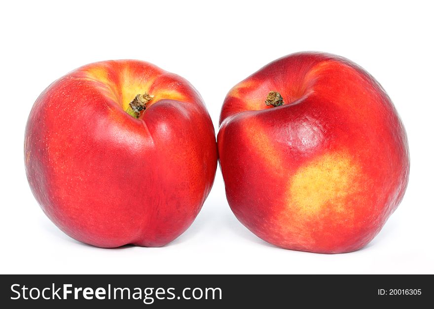 Two nectarines on white background