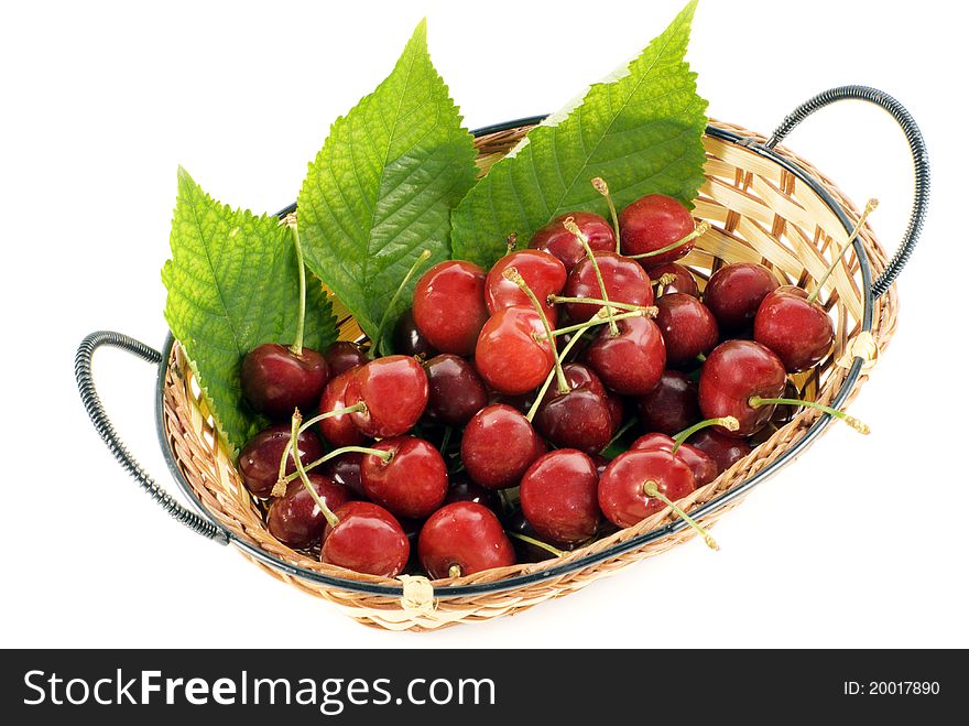 Cherry in basket on white background
