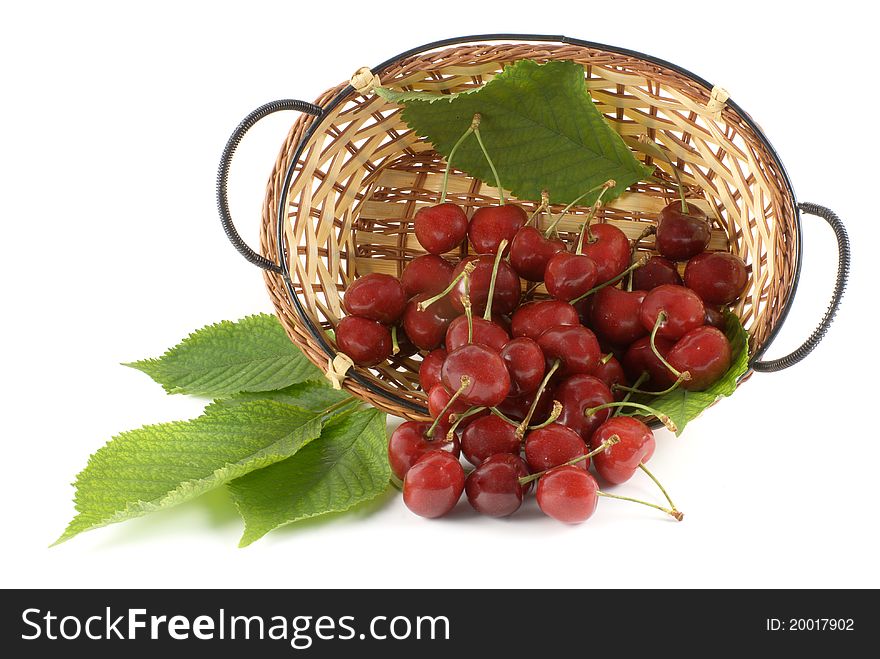 Cherry in basket on white background