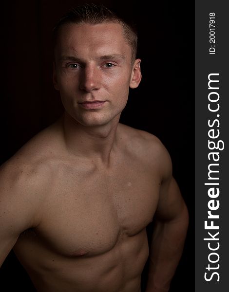 Muscular Man On Black, Isolated